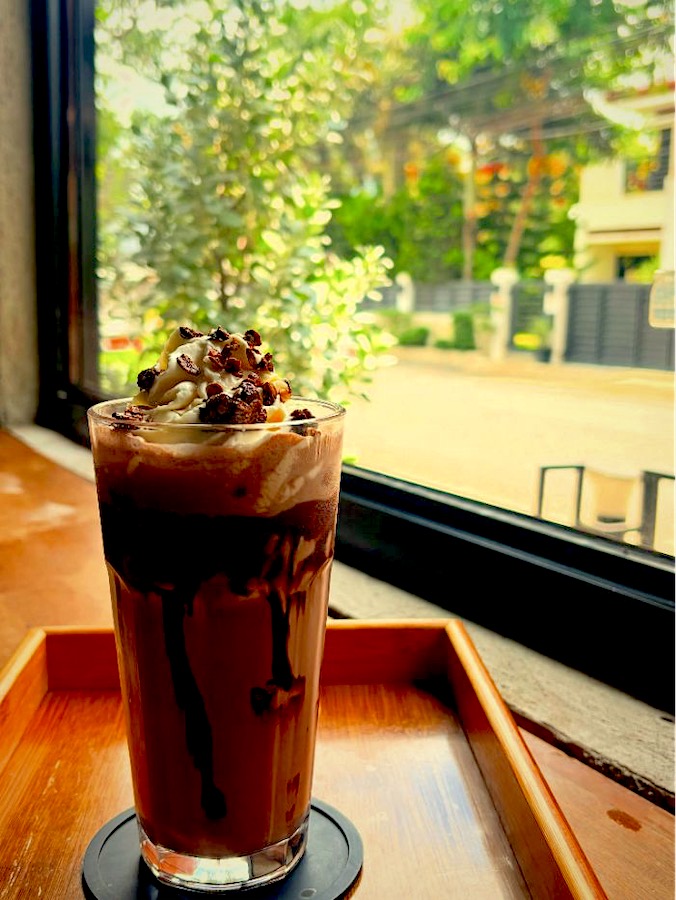A chocolate frappé by the window