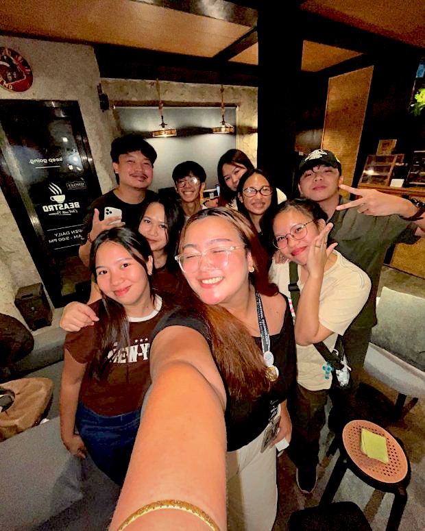 Friends taking a selfie by the door